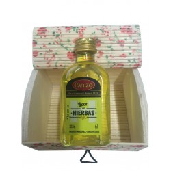 Baúl floreado con licor en miniatura