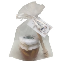 Tarro de miel con almendras y palito catador para empresas